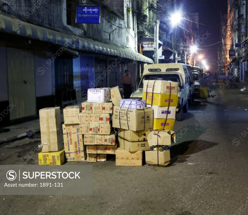 Stack of cardboard boxes in a street, Myanmar