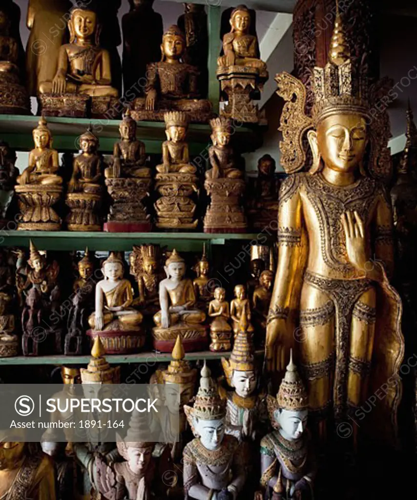 Hand crafted Buddha's statues in a market, Myanmar