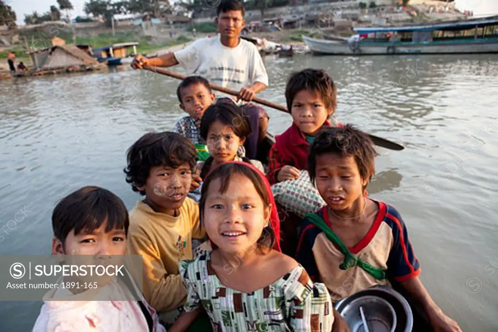 Children on a boat, Myanmar