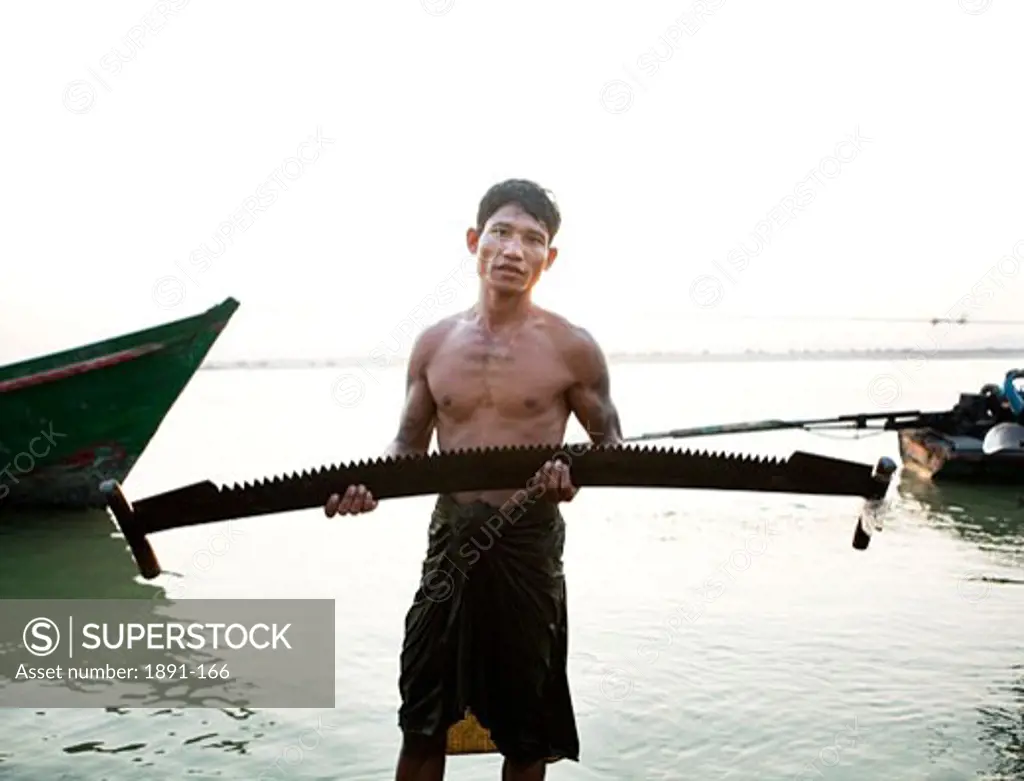 Man holding a saw, Myanmar