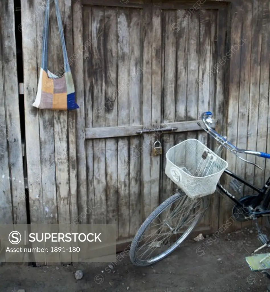 Bicycle in front of a door, Myanmar