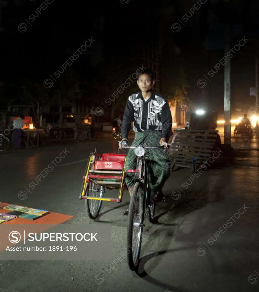 Man riding a pedicab, Myanmar