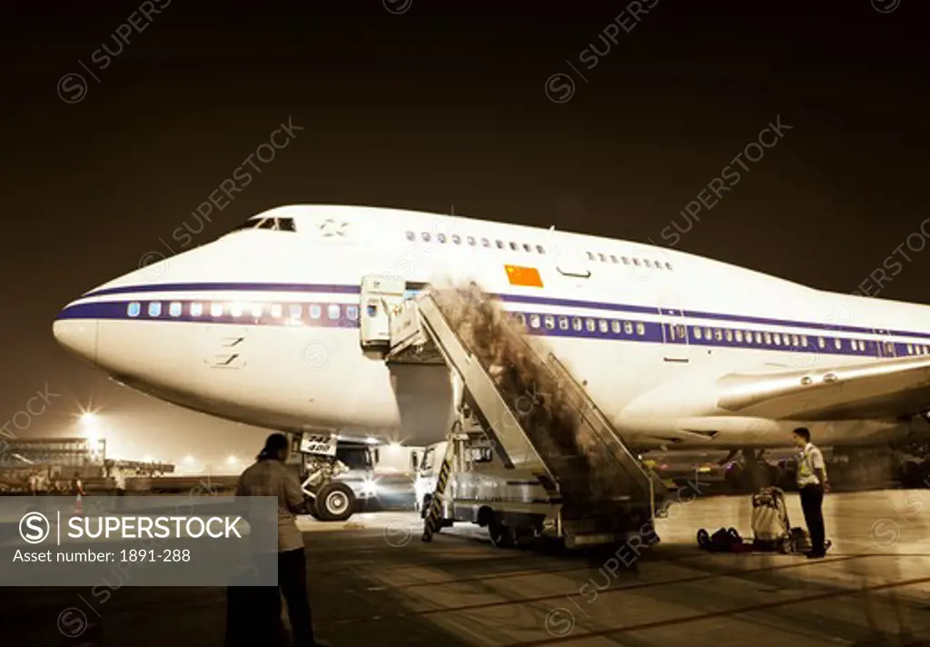 People boarding Boeing 747, China