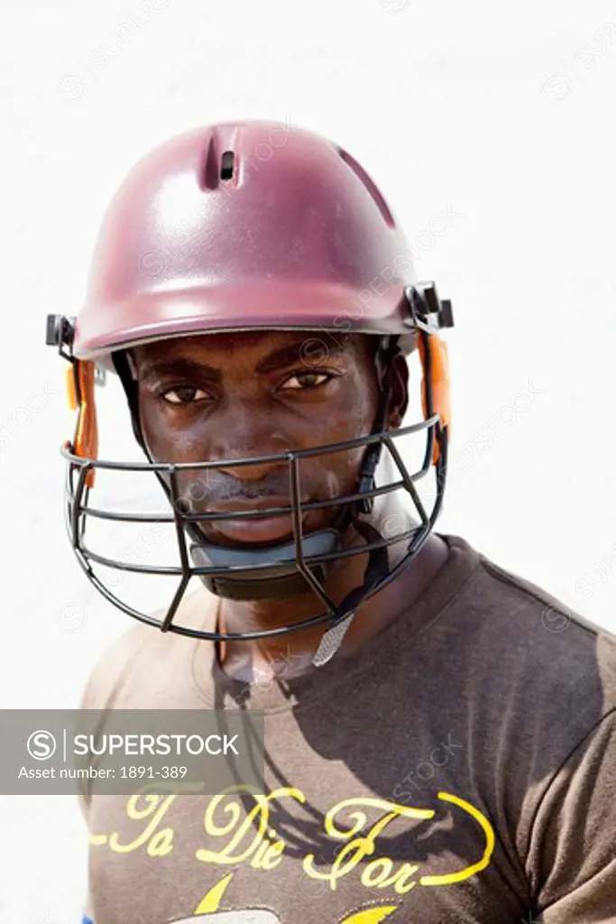 Close-up of a man wearing a cricket helmet, Jamaica