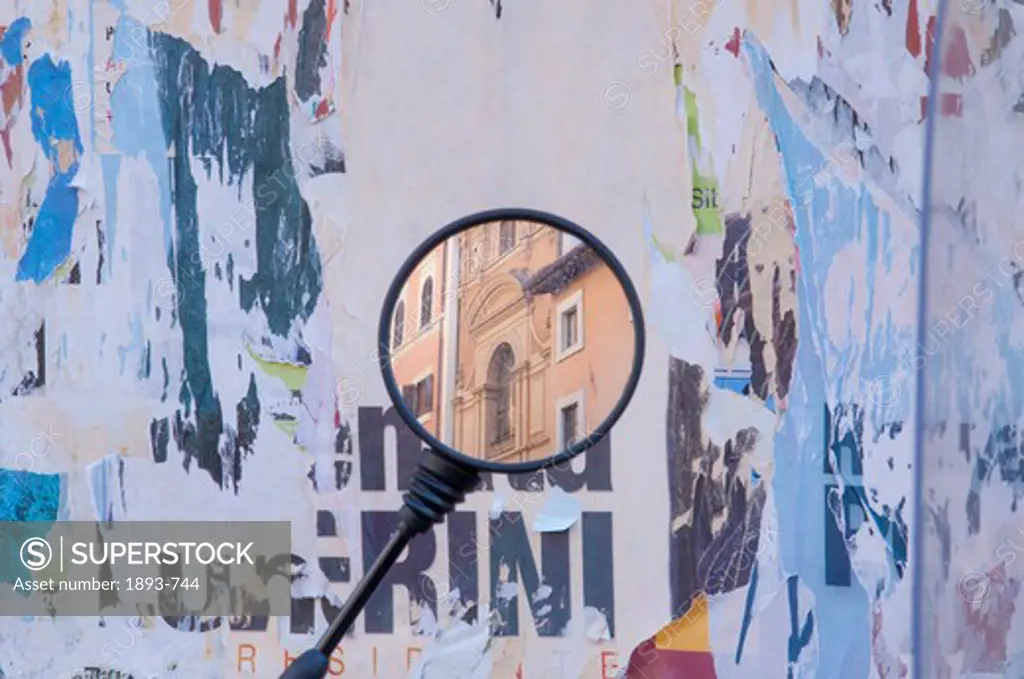 Italy, Rome, Classical architecture is juxtaposed in vespa rear view mirror set against messy poster billboard