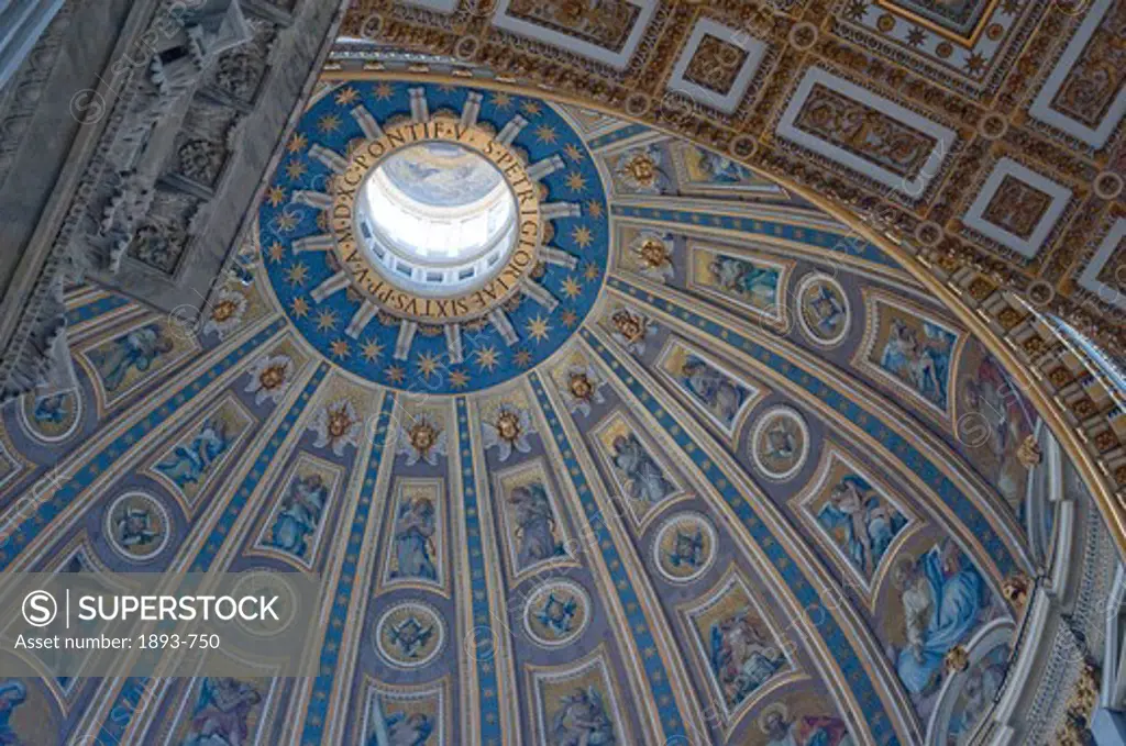 Italy, Rome, Looking up at Michelangelo-designed dome on Saint Peter's Basilica in Vatican,