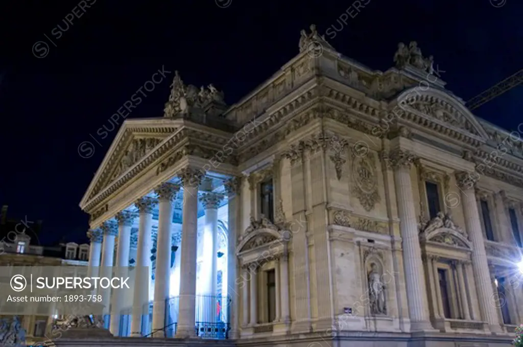 Belgium, Brussels, Low angle night view of Brussels Stock Exchange La Bourse