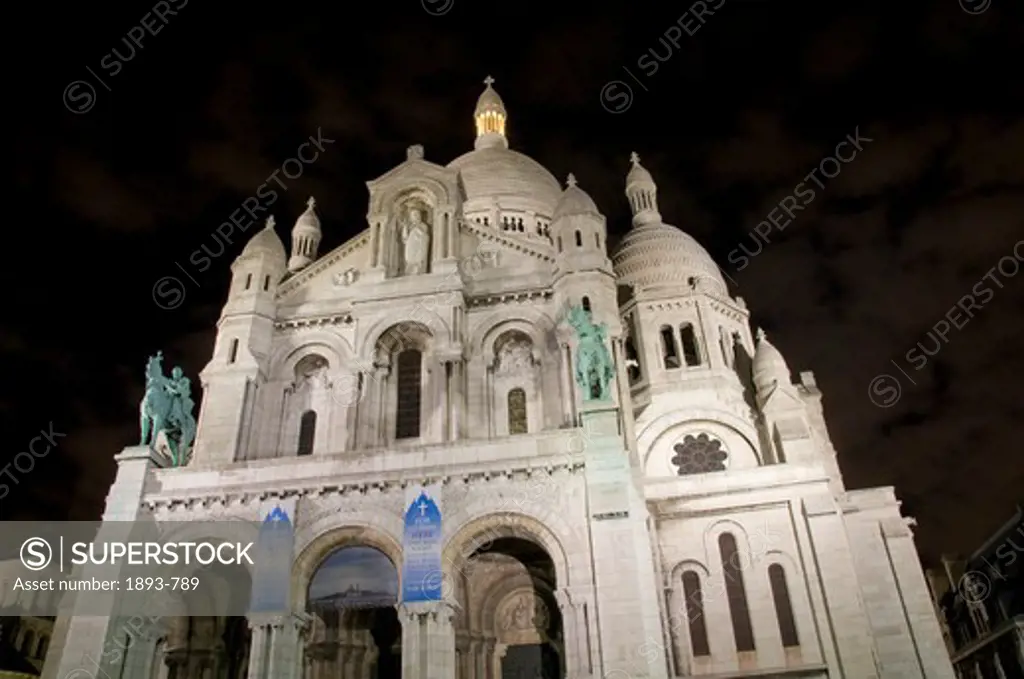 France, Paris, Low angle night shot of Sacre Coeur