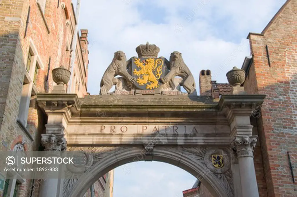 Coat of arms on an archway, Bruges, West Flanders, Flemish Region, Belgium