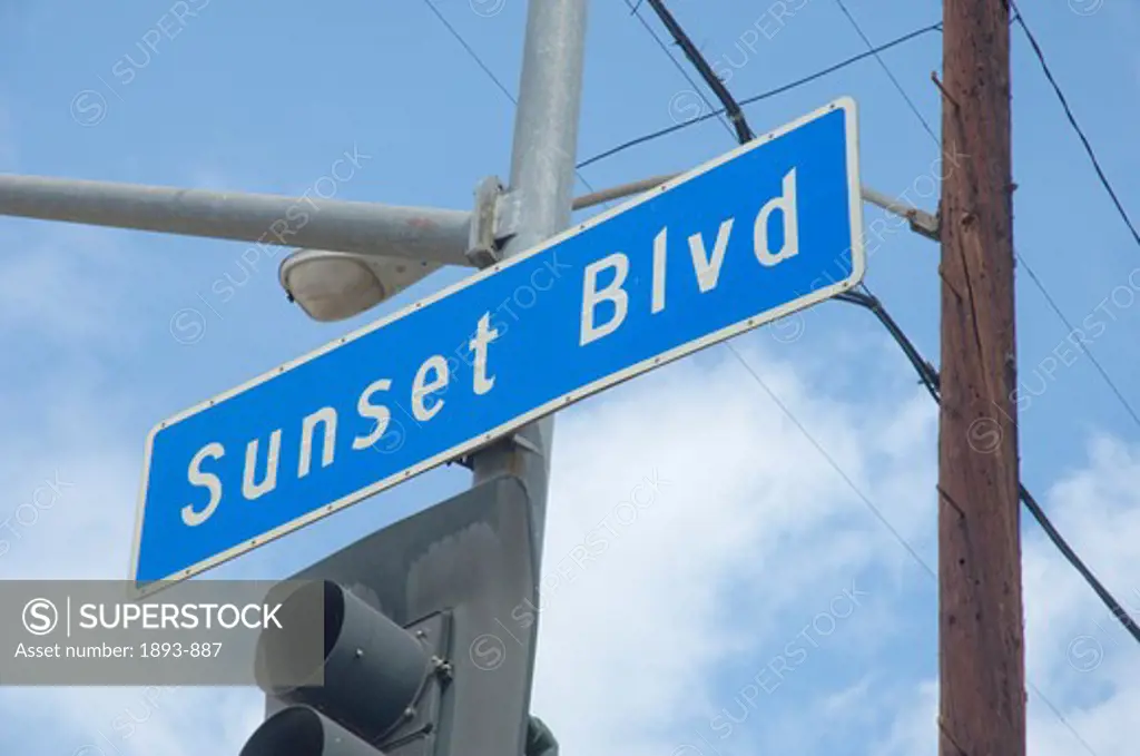 Low angle view of a street name sign, Sunset Boulevard, Los Angeles, California, USA