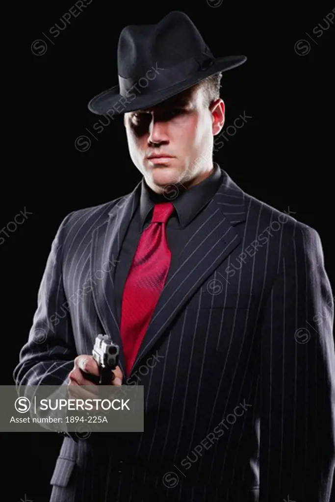 Businessman aiming with a gun