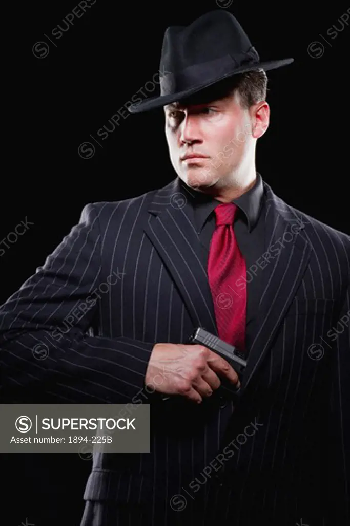 Businessman taking out a gun