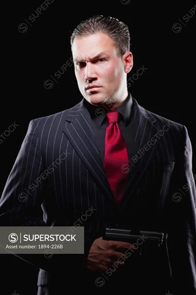 Businessman holding a gun