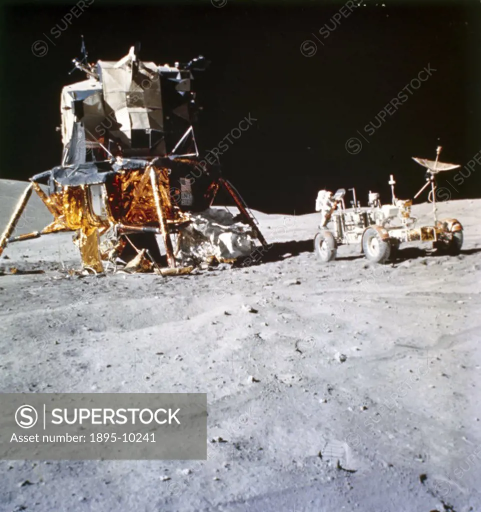 This picture shows the Apollo 16 Lunar Module Orion’, and the Lunar Rover on the Moon, with astronaut John Young in the background. Apollo 16, carryi...