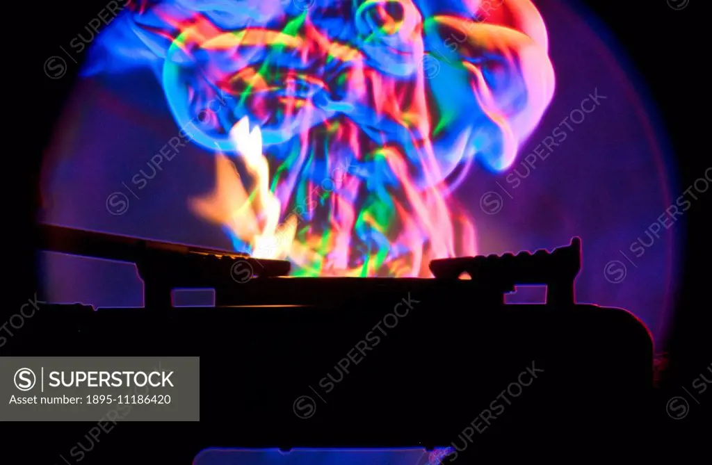 Colour Schlieren photograph of a campstove being lit. A high speed photograph of a camp stove being lit. The change in heat during the short duration ...