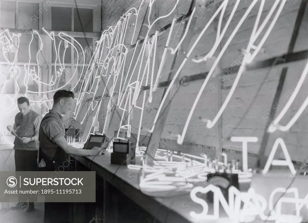 Photograph by James Jarche (1891-1965). Trade & Industry: Manufacturing, Neon Signs. Two men working on neon tube signs, 1933.