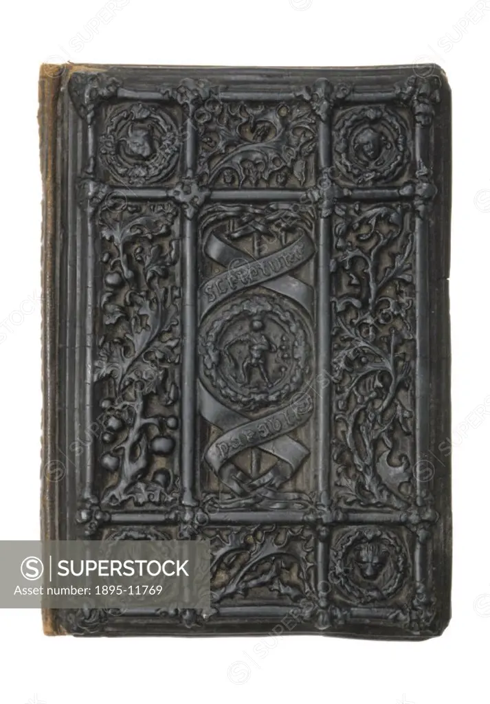 This ornate cover for a book of scriptures and parables is made of a composite material called carton pierre, indicative of the many mouldable compoun...