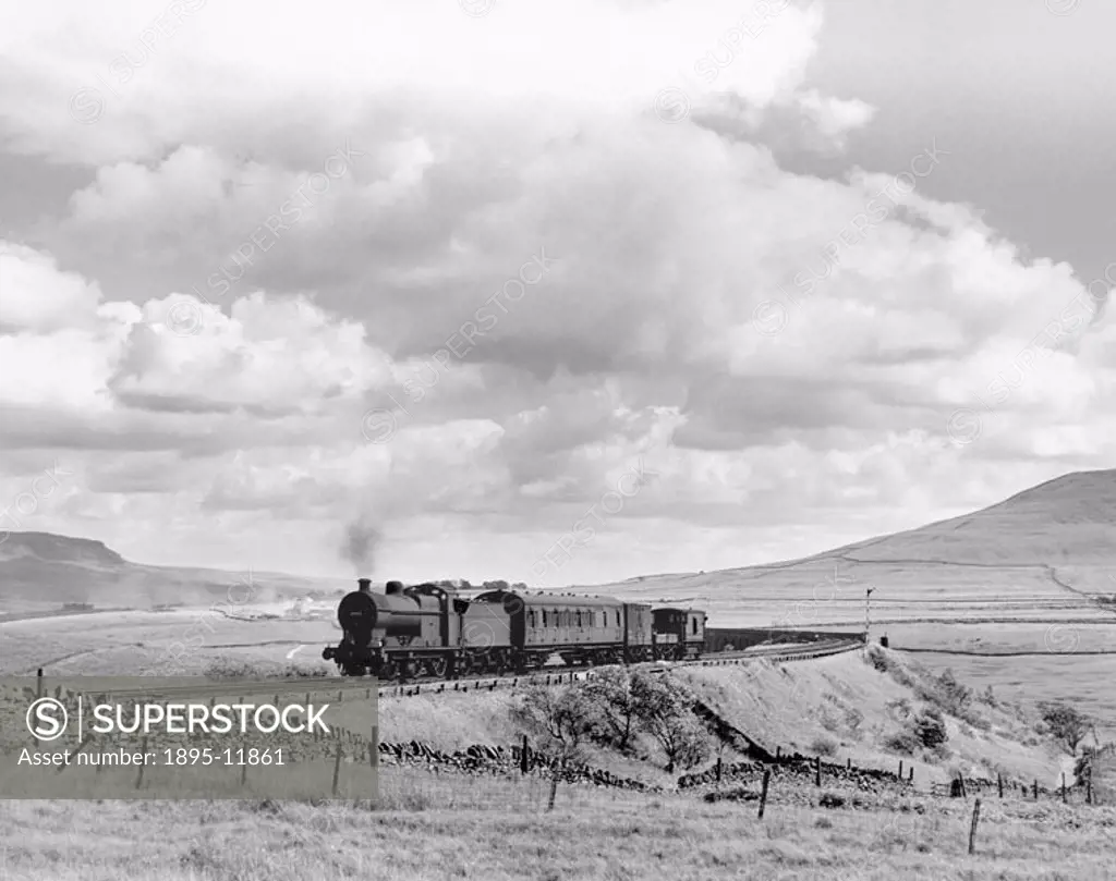 Midland Railway Class 4F 0-6-0 steam locomotive with a train carrying engineers and their equipment. The train has just crossed the Ribblehead Viaduct...