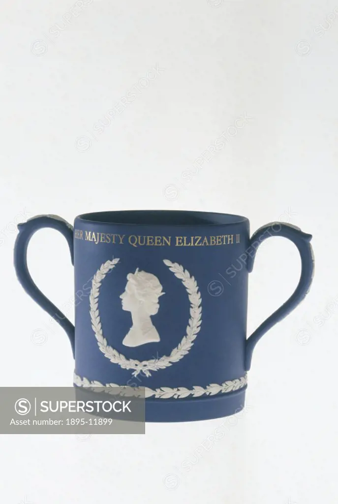 Double-handled blue mug with a white portrait bust of Queen Elizabeth II, made by Wedgwood to celebrate her Silver Jubilee in 1977.