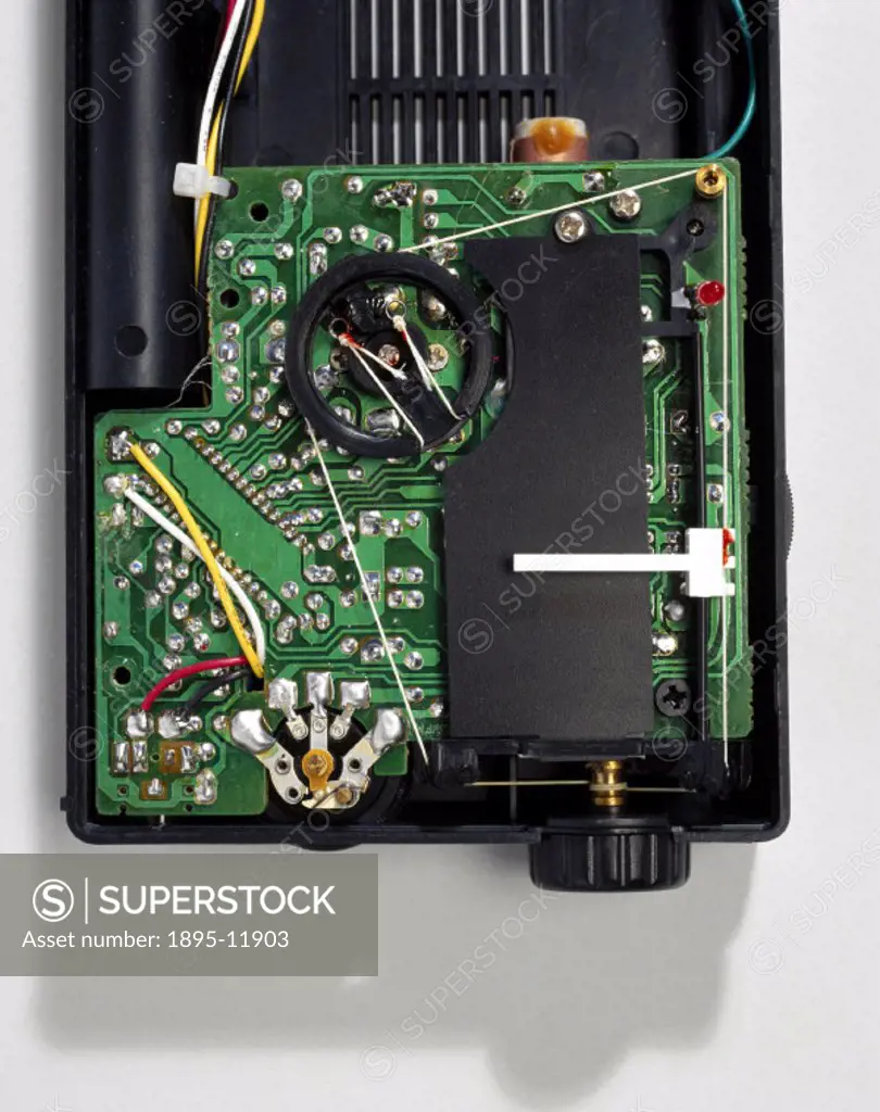 Transistor radio, 1996.A Roberts RP3, a compact, pocket-sized 3-band (FM/MW/LW) portable receiver, with the back removed to show its internal workings...