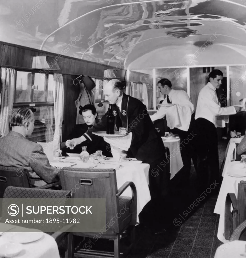 British Railways Stewards serving drinks in the First Class dining car, 1951.