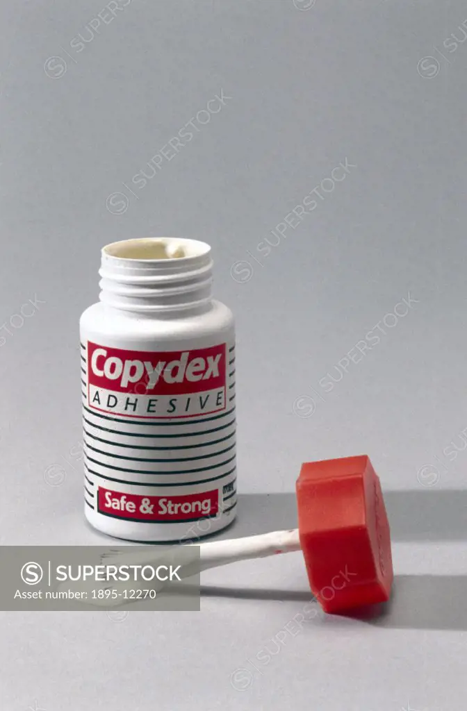 Rubber solution glue with applicator brush.