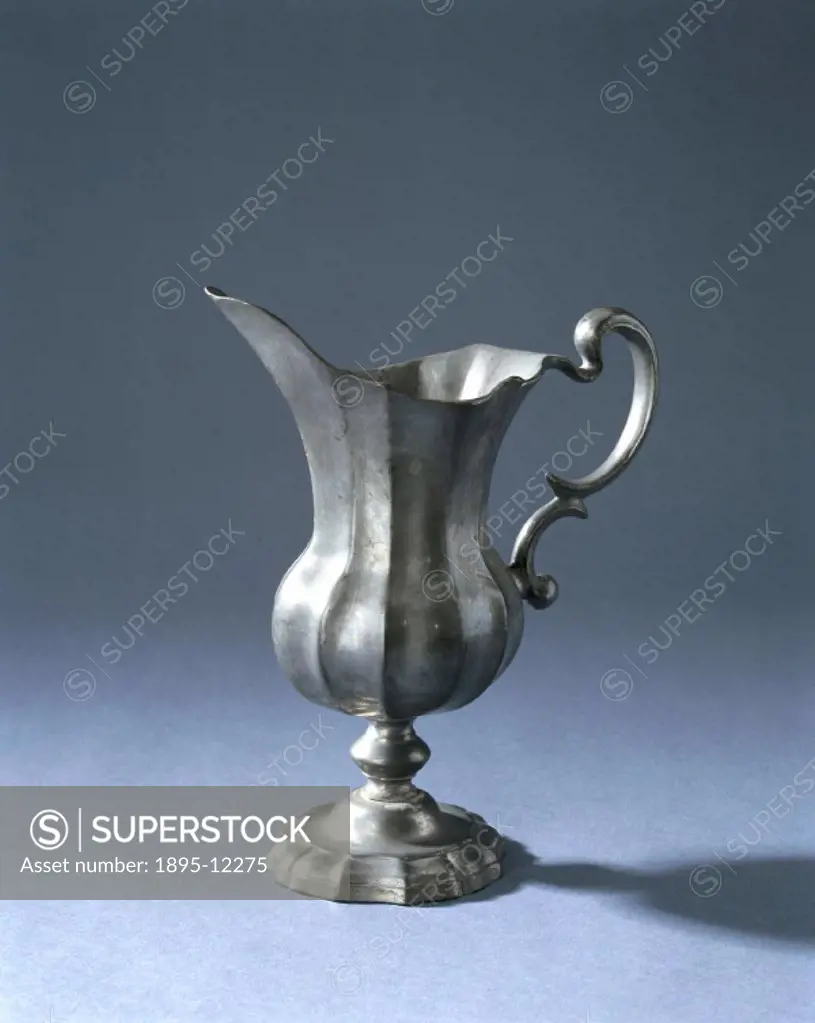 Rococo style pewter jug, with an ornate handle and a base which unscrews. Pewter is a soft alloy consisting of 80-90 per cent tin, and 10-20 per cent ...