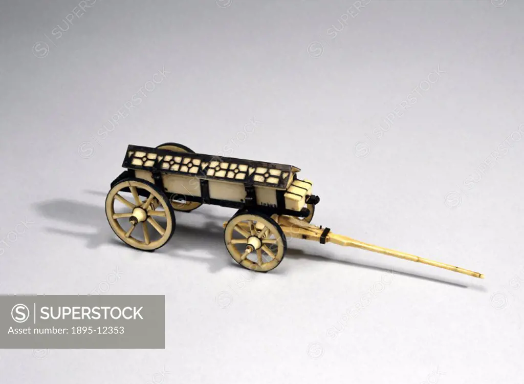 A model, made from ivory, ebony and silver, of a cart, which was possibly used as a hearse or for carrying ammunition.