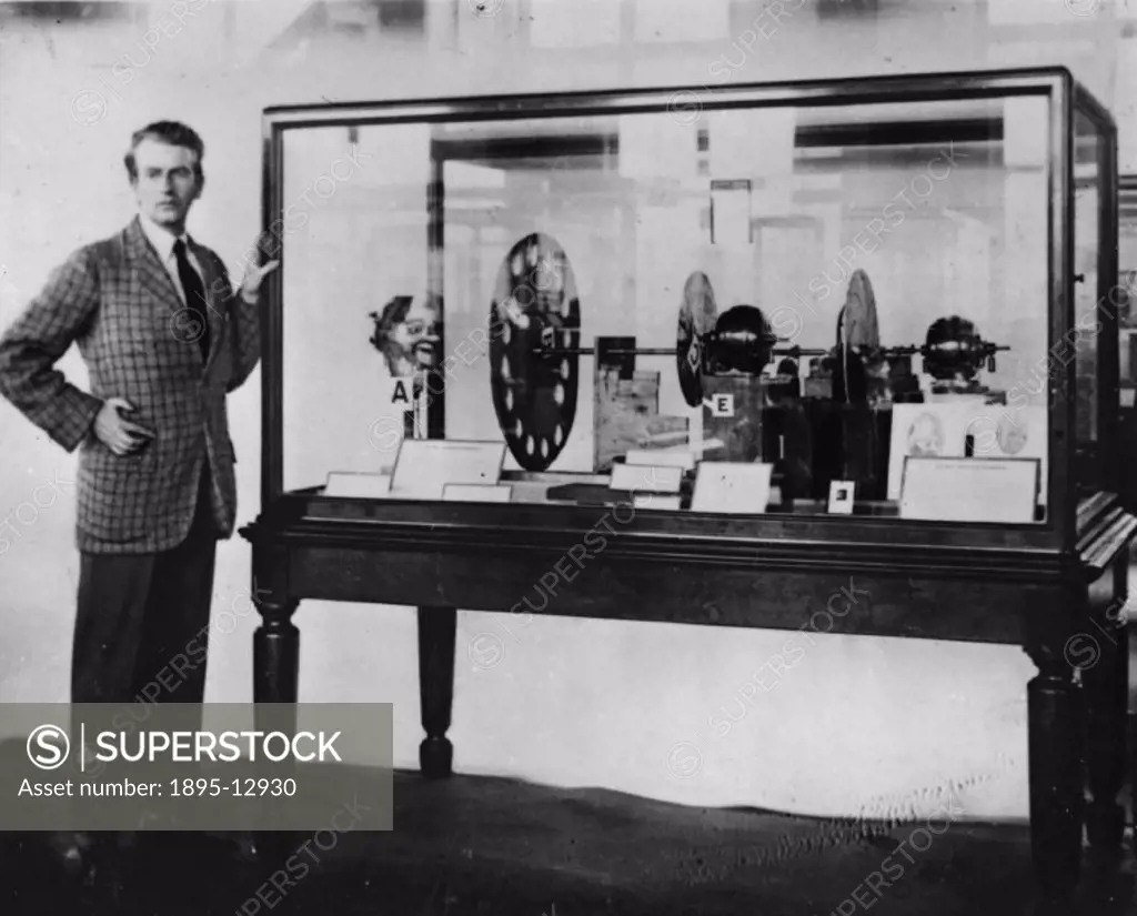 John Logie Baird presenting the transmitting portion of the original experimental Baird television apparatus to the Science Museum, September 1926. Ba...