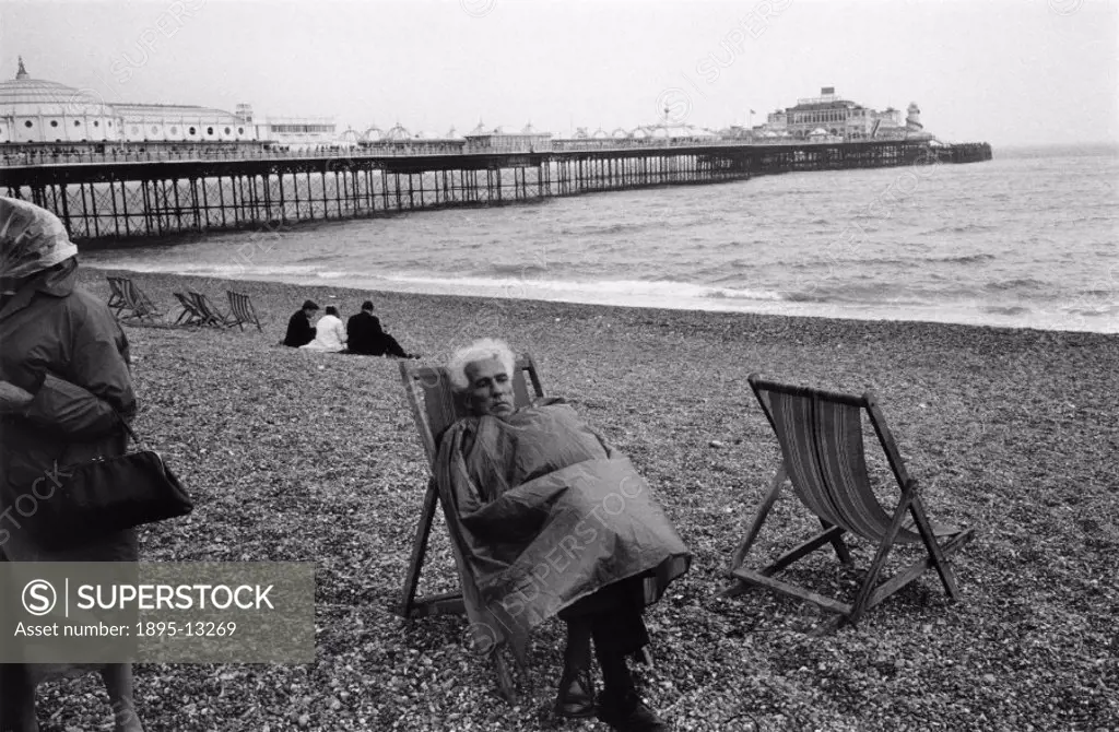 Taken near the Palace Pier at Brighton, West Sussex. Photographer Tony Ray- Jones (1941-1972) created most of his images of the British at work and le...