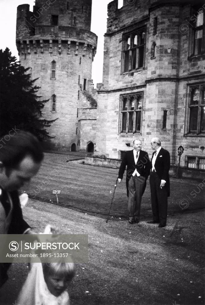 Two elderly men standing in the gardens of a country house during a society wedding in Cumbria in 1967. Photographer Tony Ray-Jones (1941-1972) create...