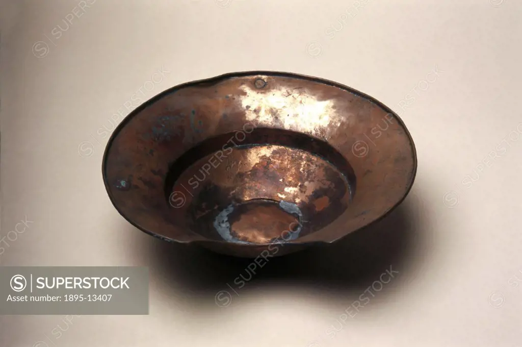 This copper bowl, with a typical cut-out neck, was used to collect the blood from shaving cuts.