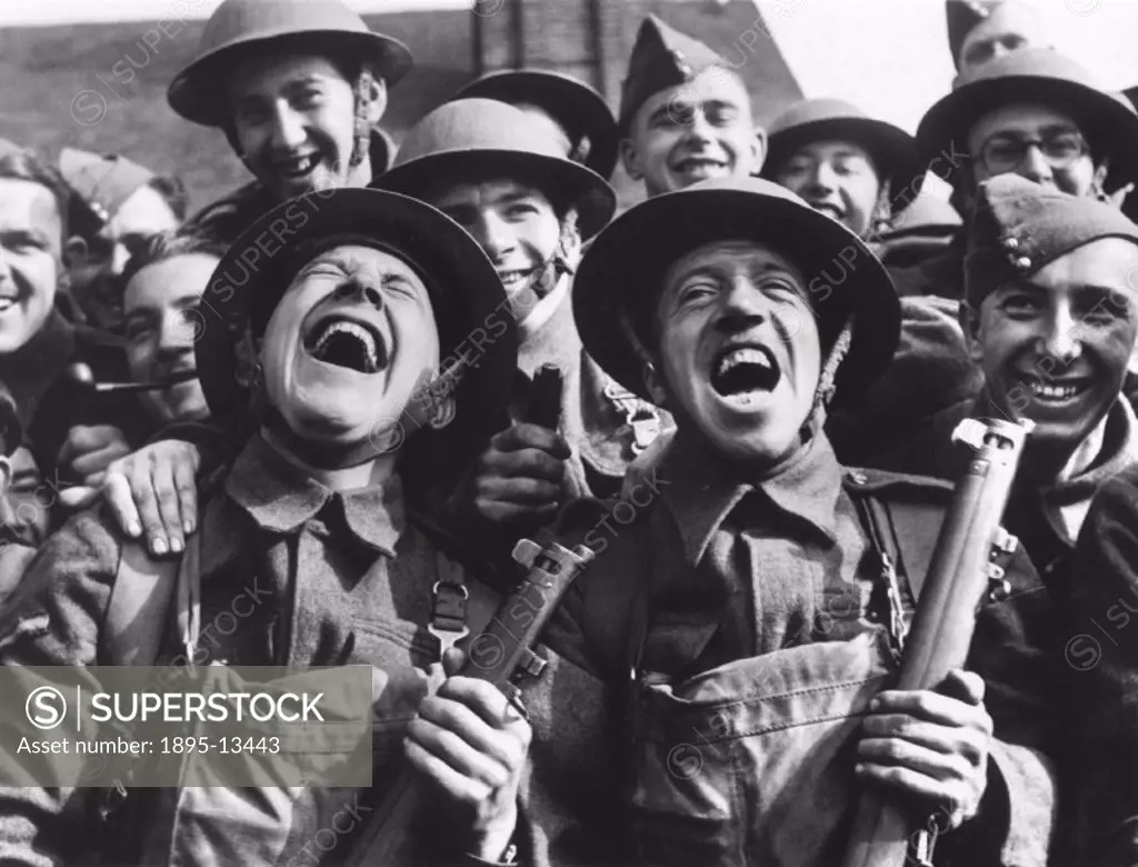 British soldiers laughing during an open air concert, c 1942.