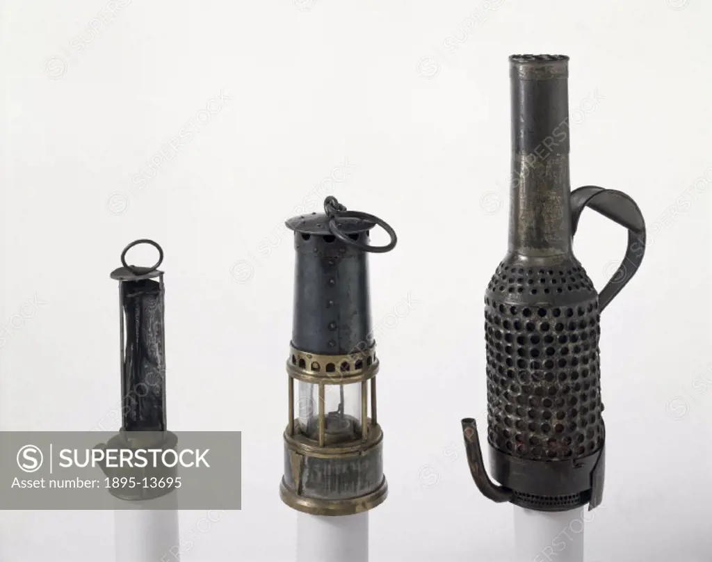 The Davy lamp on the left, designed by Sir Humphry Davy (1778-1829) in 1815, consists of a cylinder of wire gauze containing a wick attached to an oil...