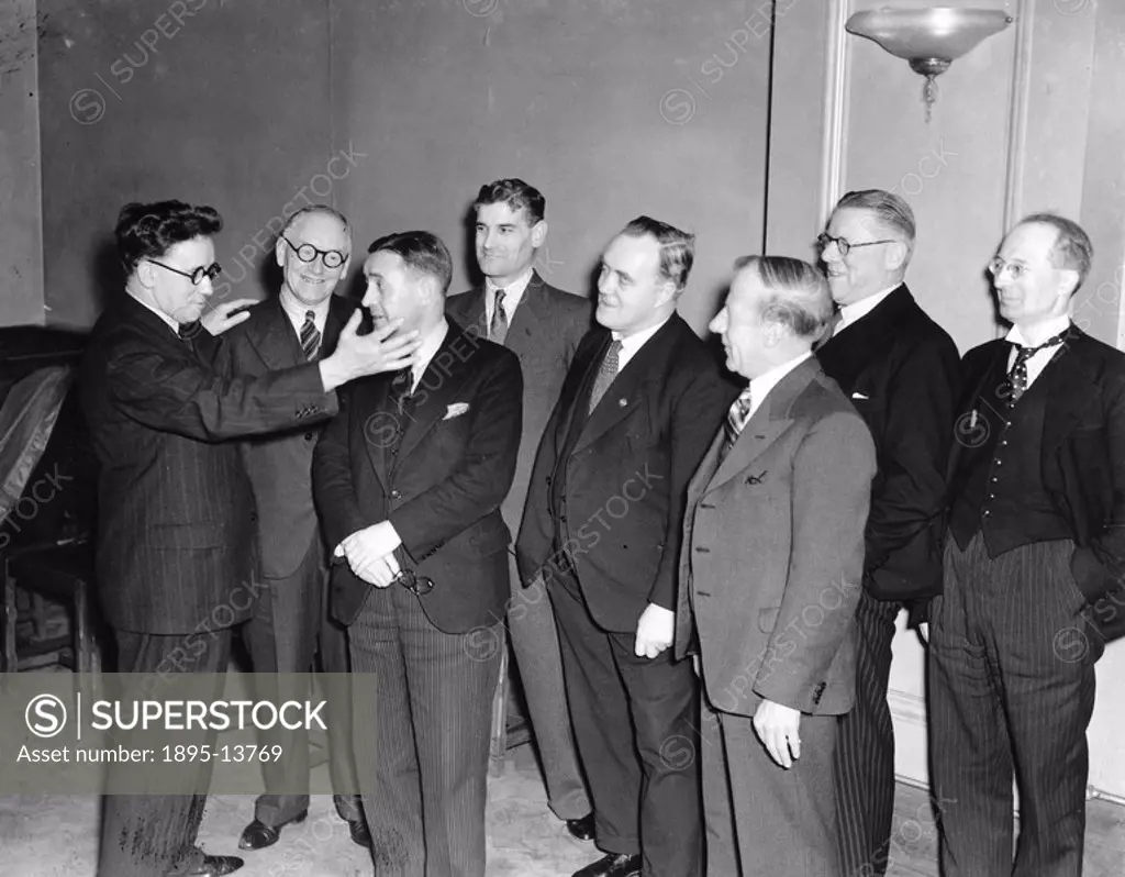 Herbert Morrison left at a Labour Party reunion at the Horticultural Hall in Vincent Square, London, 30 January 1937  Morrison is shown talking to a g...
