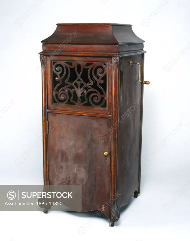 Model A phonograph, contained in an upright floor-standing cabinet. It has four drawers which each hold twenty-five cylinder boxes in clips. The horn ...