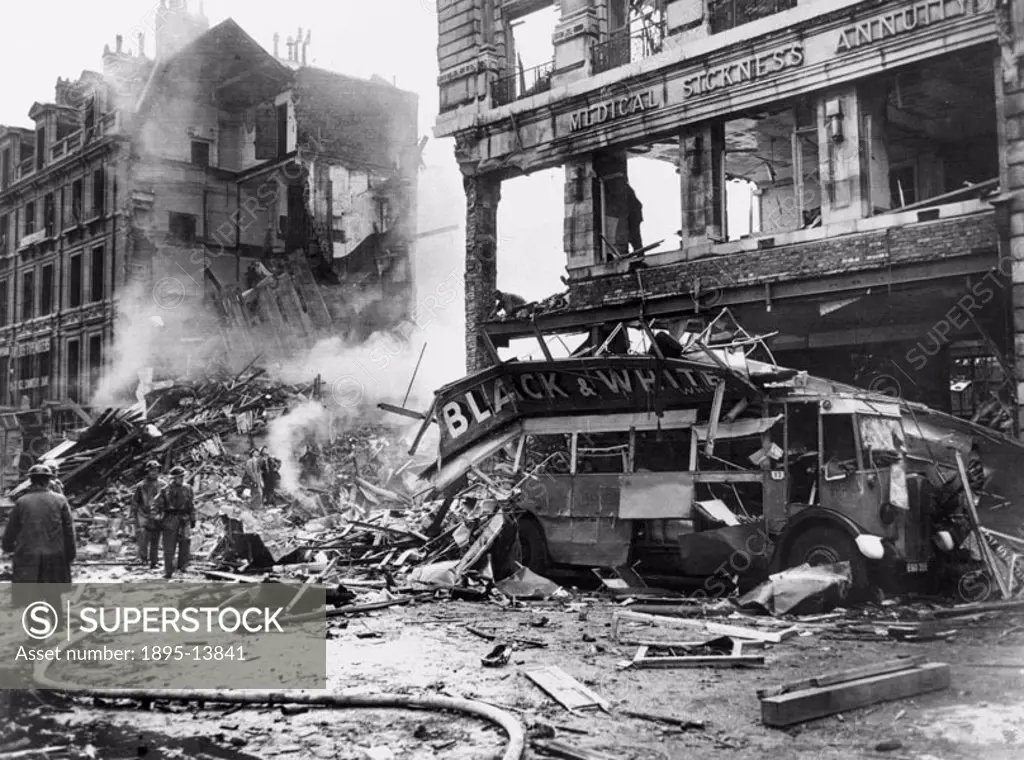 A double-decker bus after being wrecked by ememy bombs during the Blitz.