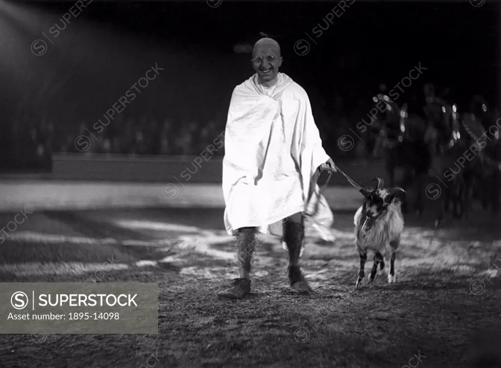 ´Mahatma Gandhi´ leading a goat around a circus ring, c 1930s