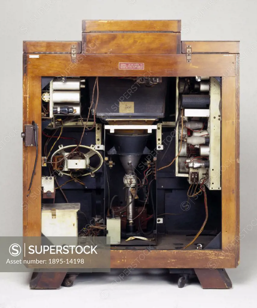 Internal view of the television set, showing the workings. This complete home entertainment system from HMV (His Masters Voice), comprising a 9 inch ...