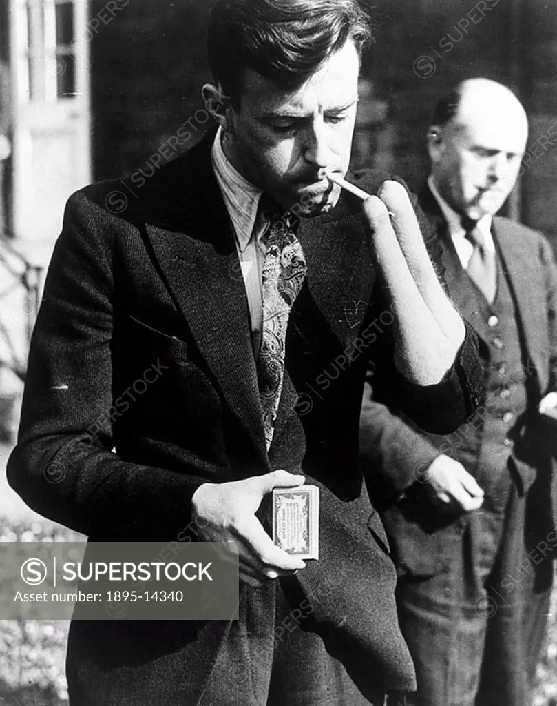 ´Demonstrating German surgical methods at the Ministry of Pensions Hospital at Leeds  Josef Peters lighting a cigarette using the stumps of his right ...