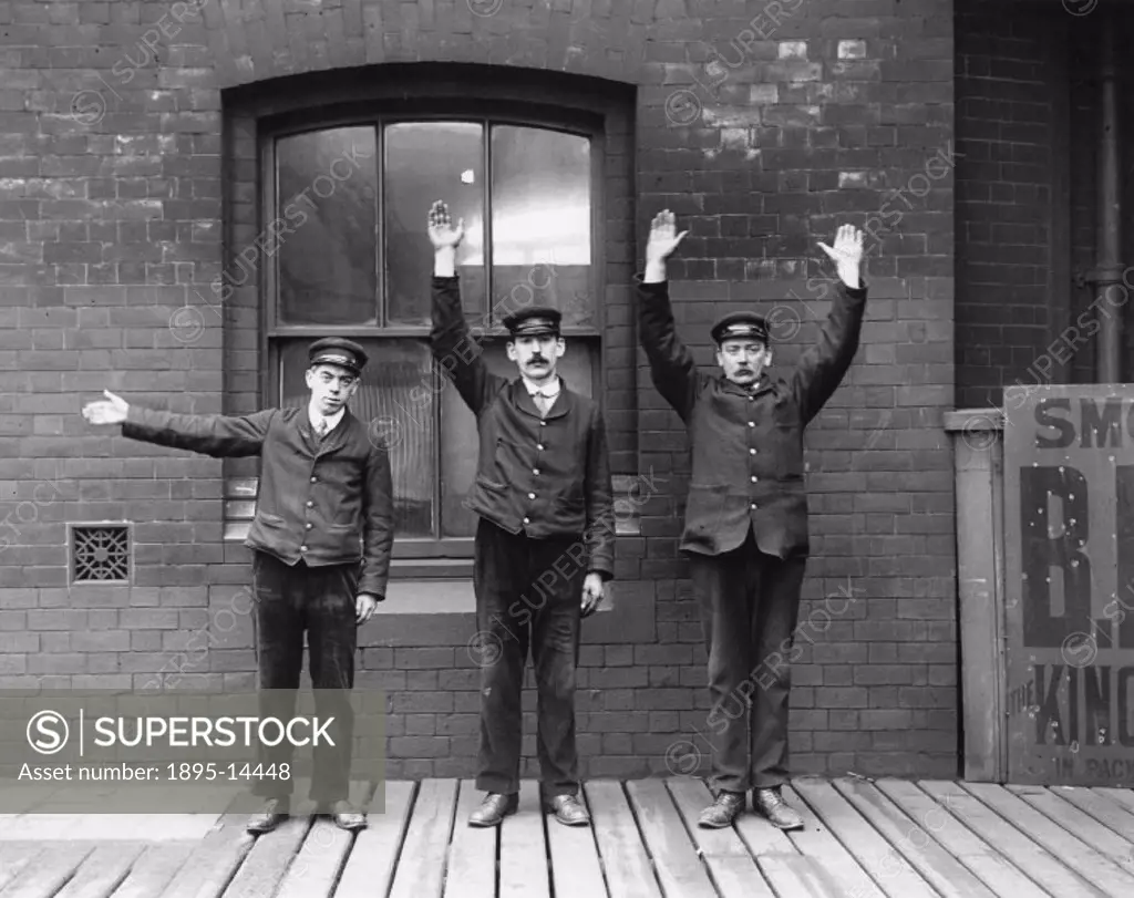 Staff of the Lancashire and Yorkshire Railway demonstrating hand signals. Photograph taken by a Lancashire and Yorkshire Railway official photographer...