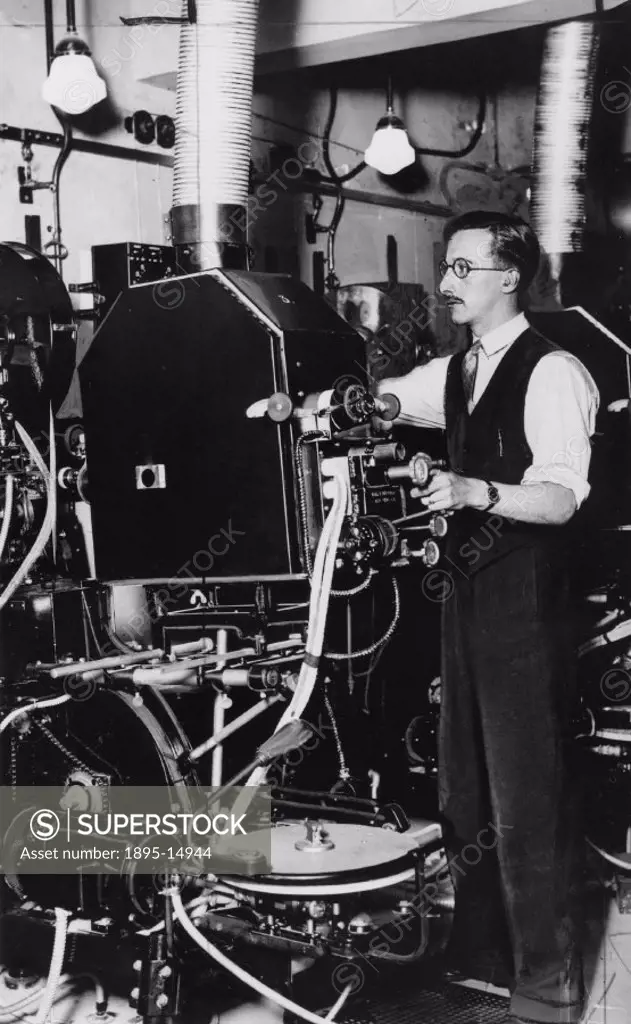 Cinema projectionist at work, January 1938.