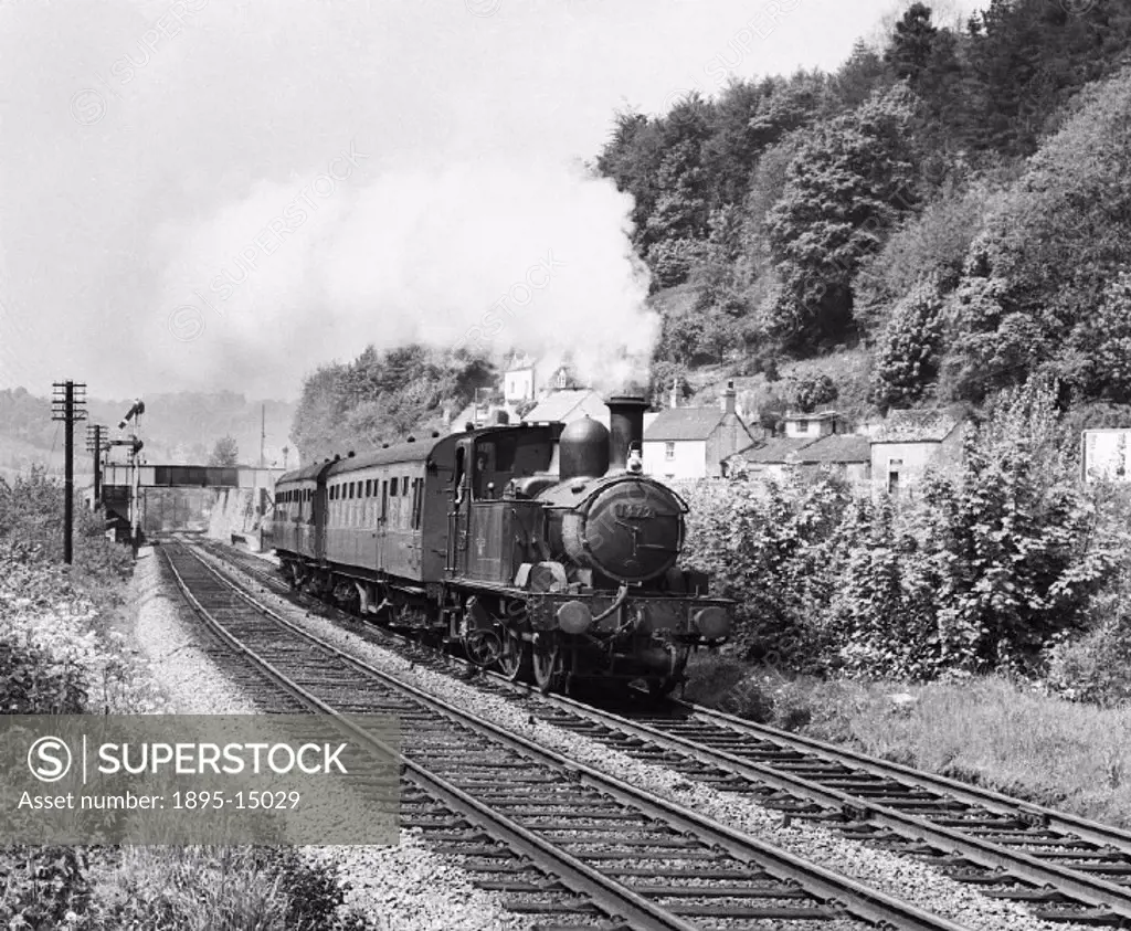 In the Golden Valley, 1400 class 0-4-2T, Number 1472 accelerates from St Mary´s Crossing halt with a Gloucester-to-Chalford train.