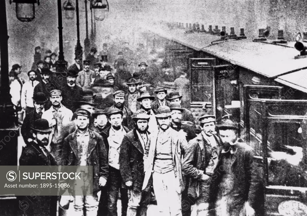 Workmen waiting at Liverpool Street Station, 25 October 1884. ´Workmen at the Great Eastern Railway´s Liverpool Street Station pose by the 12.55 pm tr...