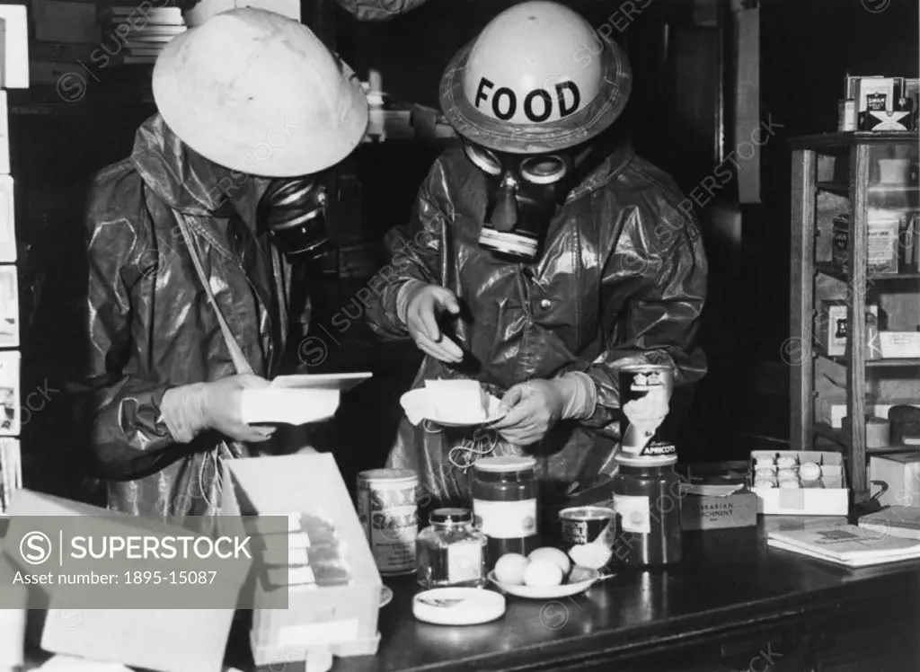 ´Westminster mock gas attack. Gas vapour has affected this shop, and the Food Inspector is making his examination of the goods. The butter will need t...