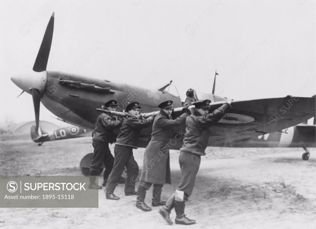 ´Four members of Finucane´s Squadron wheel out the new Spitfire. It has been specially prepared for his return´. Finucane is almost certainly Wing Com...