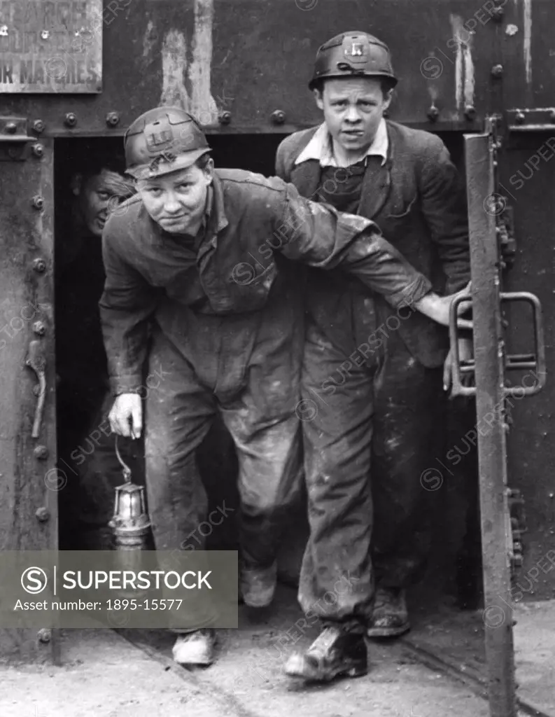 Photograph by Wilson showing two mine students leaving the pit shaft after spending their first two hours down a coal mine.