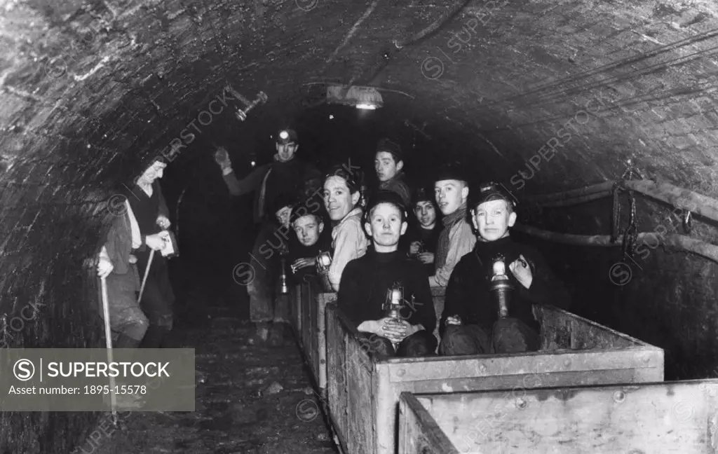 Photograph showing boys on an educational visit underground at the colliery of Newton Chambers & Co Ltd in Thorncliffe, near Sheffield. The objective ...