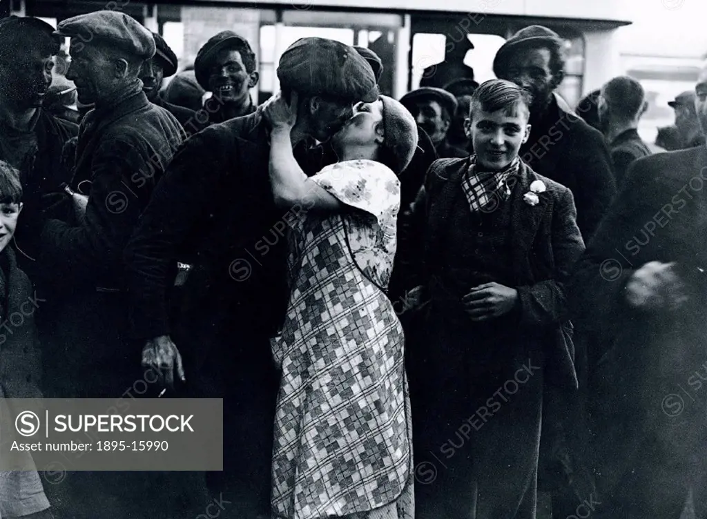 Stay-in´ strikers being welcomed back by their families at Bedwas, Caerphilly in Wales. The coal mining industry was one of the major battlegrounds i...