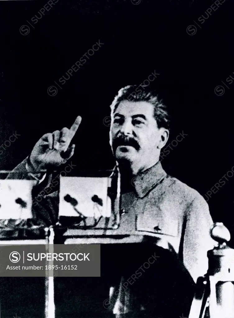 A press photograph of Joseph Stalin (1879-1953) addressing voters from the Stalin Election District of Moscow in the Bolshoi Theatre in Moscow in 1937...